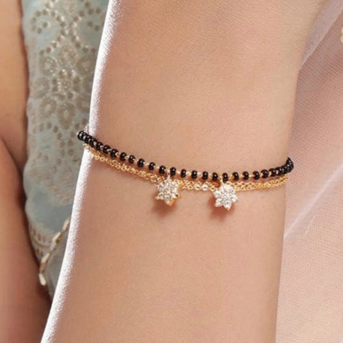 Rubans Gold-Plated Black Beaded Mangalsutra Bracelet with Zirconia Floral Charms for Women